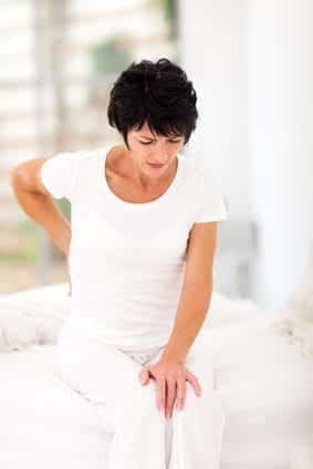 middle aged woman having back pain